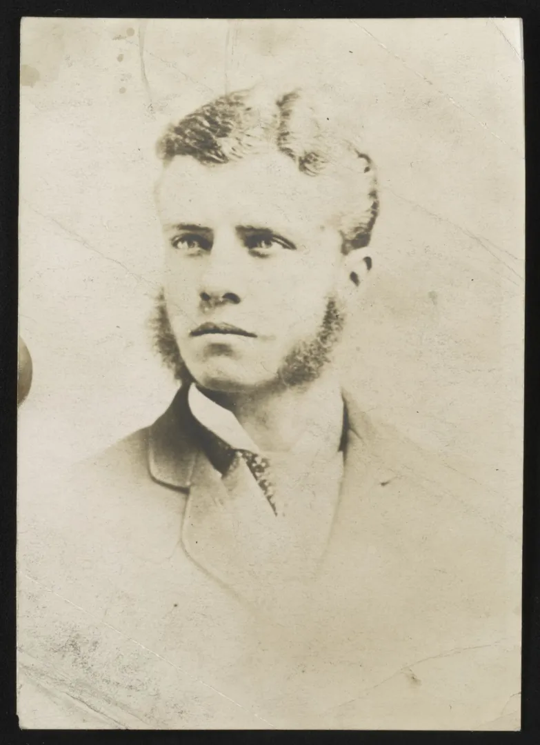 Head-and-shoulders portrait of a young Theodore Roosevelt with side whiskers