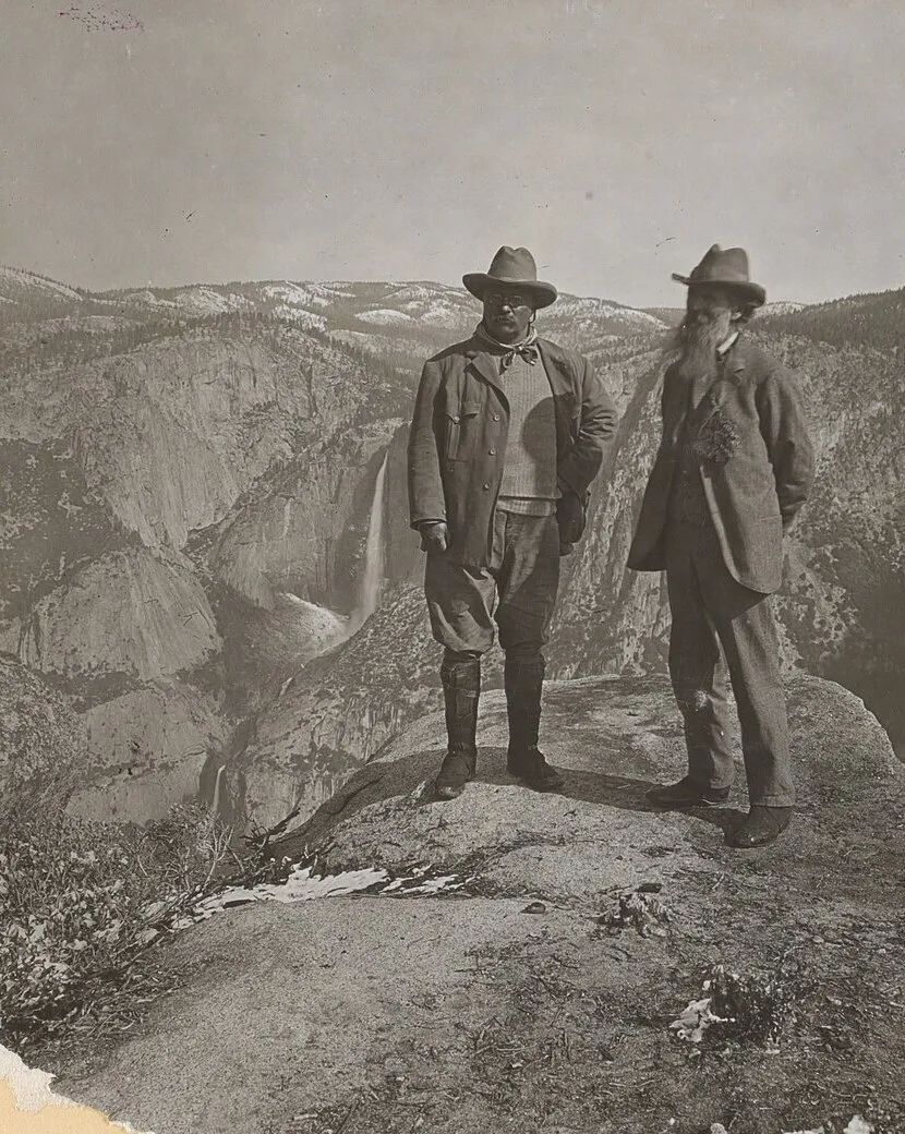 Theodore Roosevelt and John Muir standing on Glacier Point above Yosemite Valley, 1903