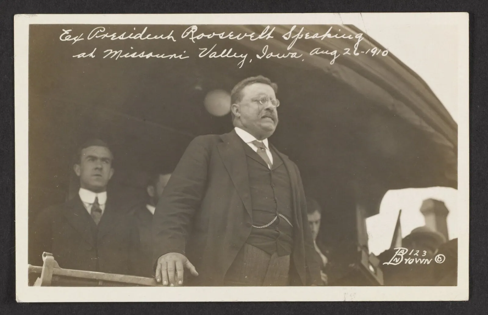 Former President Theodore Roosevelt speaking from a platform to a crowd at Missouri Valley, Iowa, August 1910