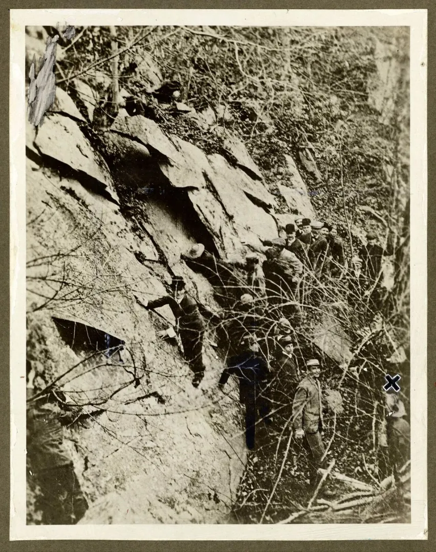 Roosevelt and companions climbing rocks in Rock Creek Park