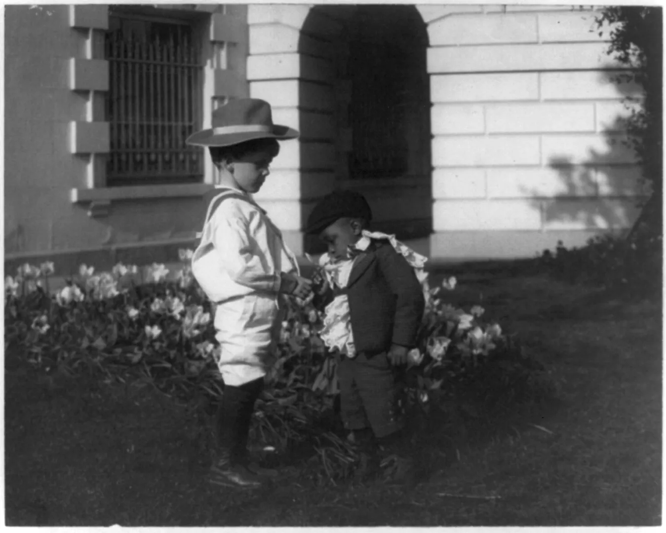 A young Roosevelt boy outside the White House offices