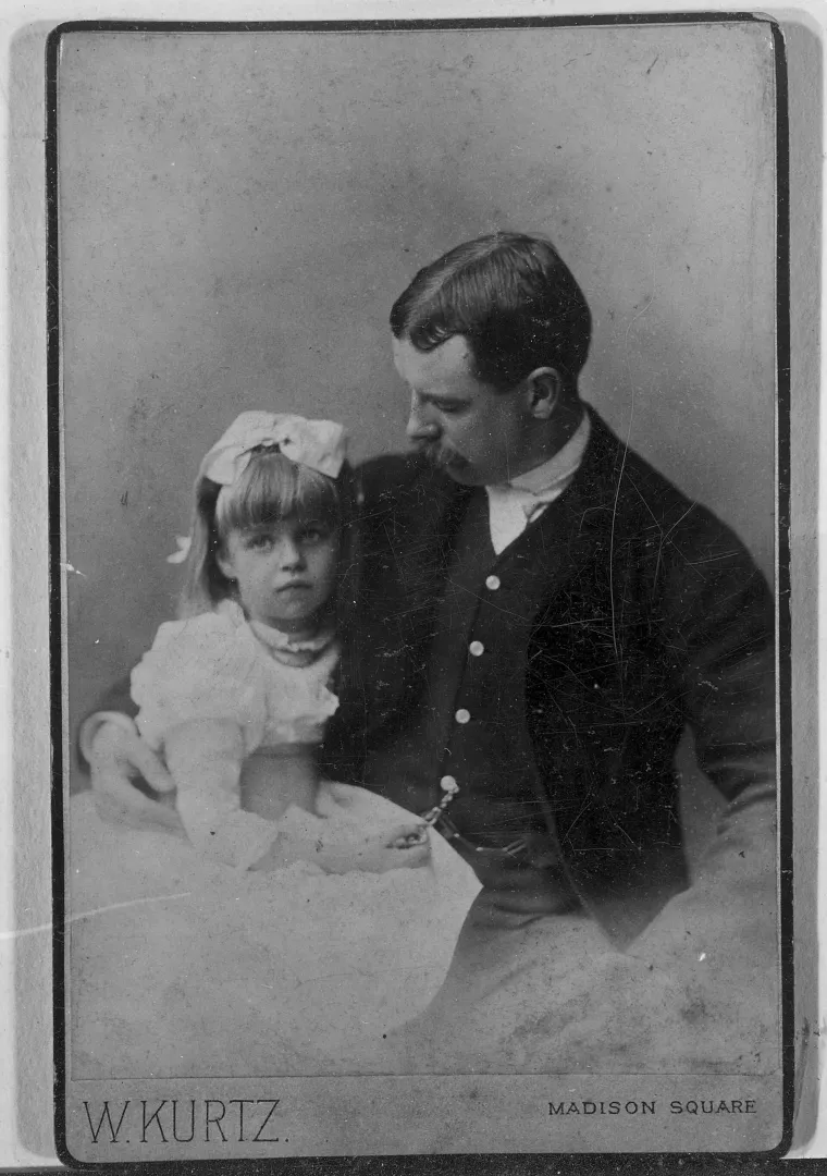 Elliott Roosevelt seated with his young daughter Eleanor