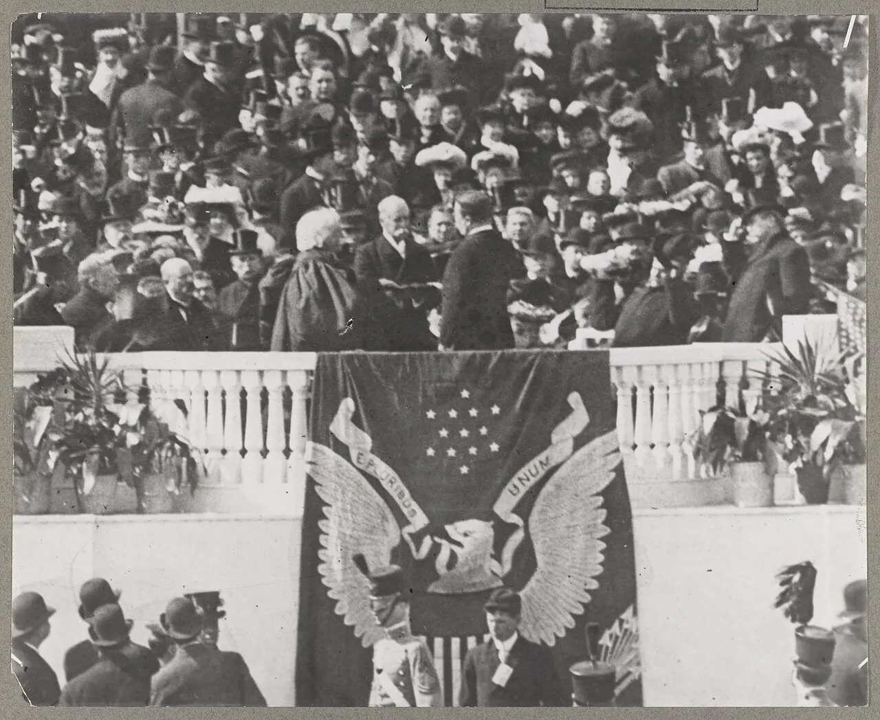 Theodore Roosevelt on the flag-draped inaugural stand at the U.S. Capitol before a large crowd on March 4, 1905