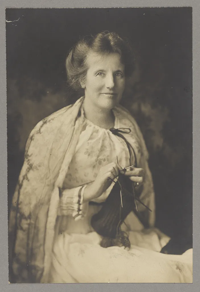 Edith Roosevelt seated and knitting.
