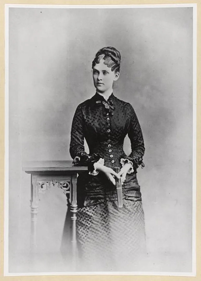 Alice Hathaway Lee Roosevelt, standing in a long dark dress, in a three-quarter length studio portrait