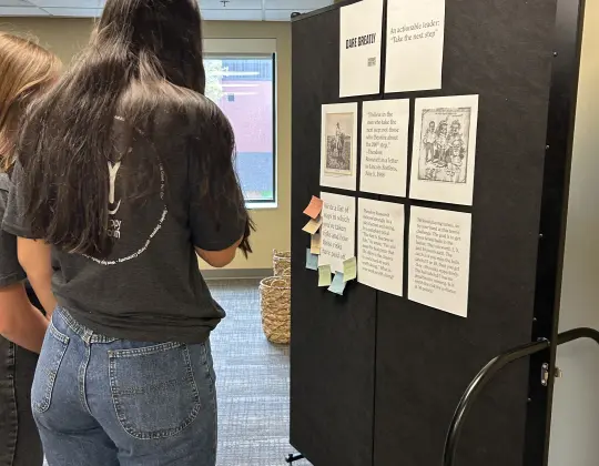 Photograph of young people considering values of importance to Theodore Roosevelt as part of an educational activity