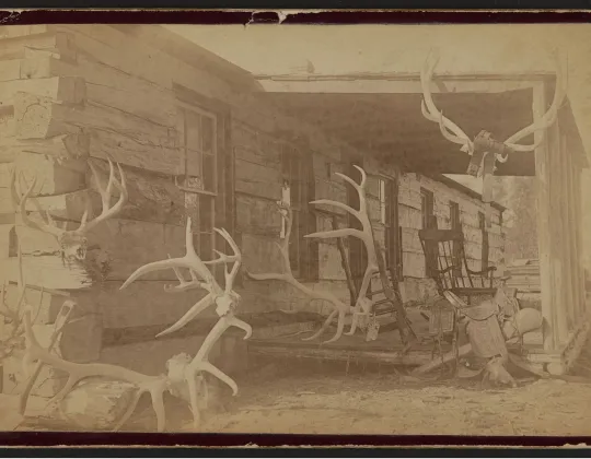 The Elkhorn ranch house, its porch hung with elk antlers