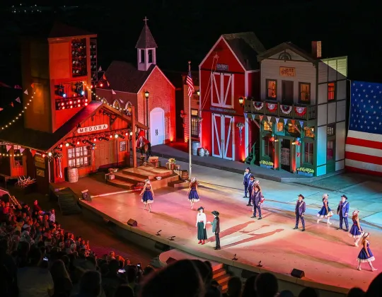 The Medora Musical stage lit at night with an American flag