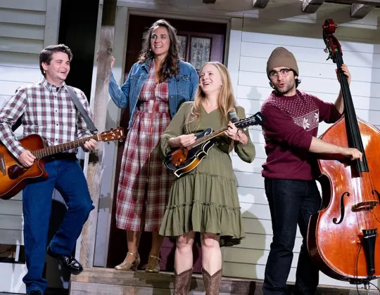 Christmas show cast with guitar, mandolin and upright bass
