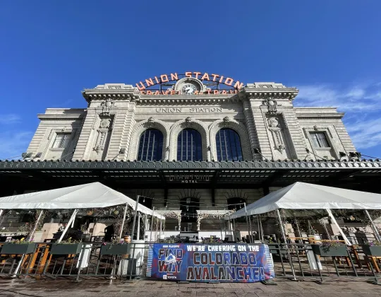 The Beaux-Arts front of Denver Union Station under a blue sky