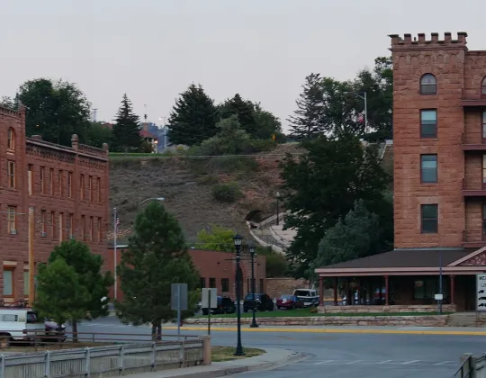 Red sandstone commercial buildings lining a street in Hot Springs, South Dakota