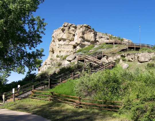 A boardwalk climbing the sandstone face of Pompeys Pillar