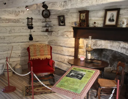 The log walls and furnishings inside John Brown's cabin