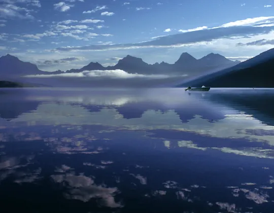 Lake McDonald reflecting mountains at dawn