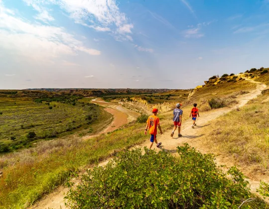 Hikers on the Wind Canyon Trail above the Little Missouri River
