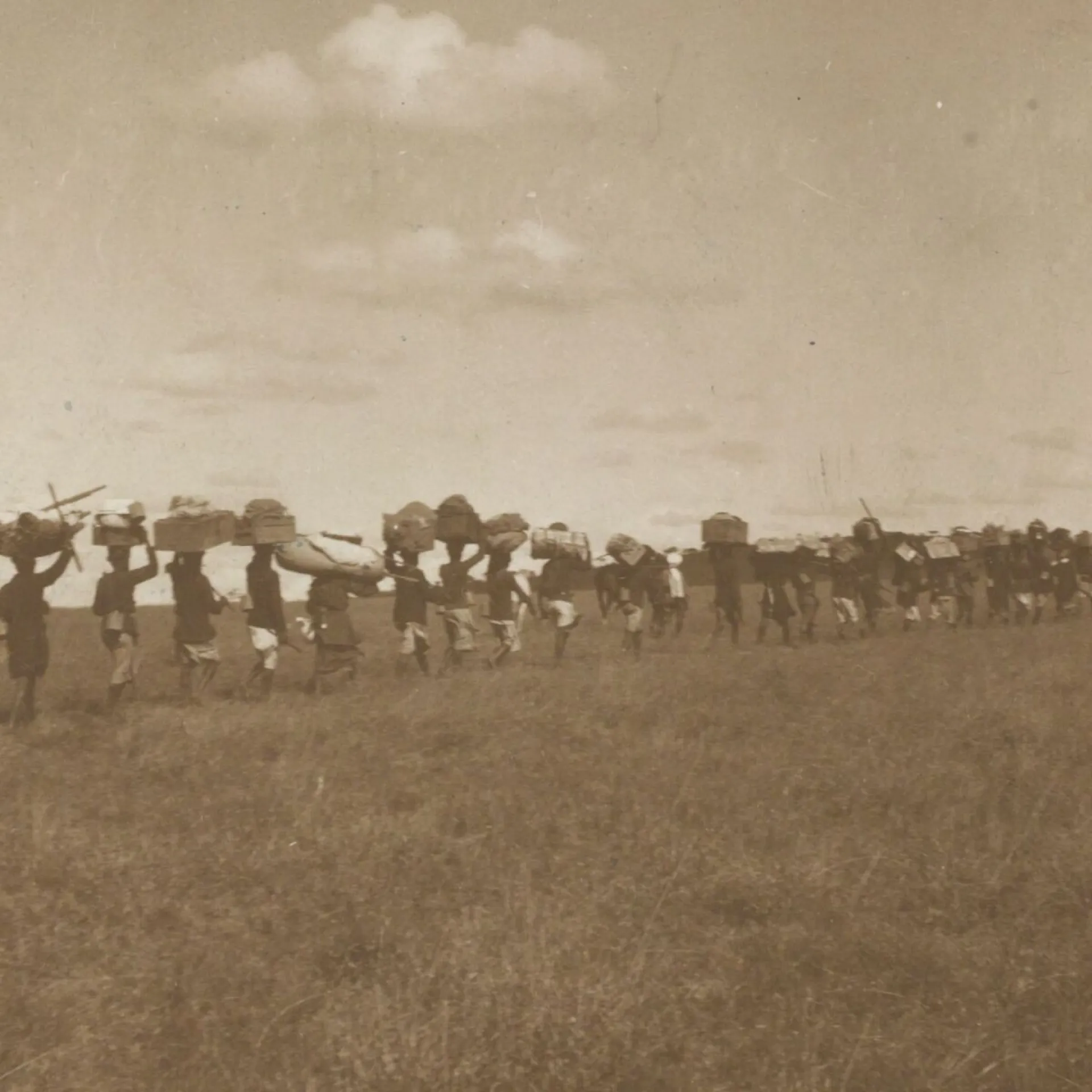 A long line of porters carrying supplies on the Roosevelt expedition
