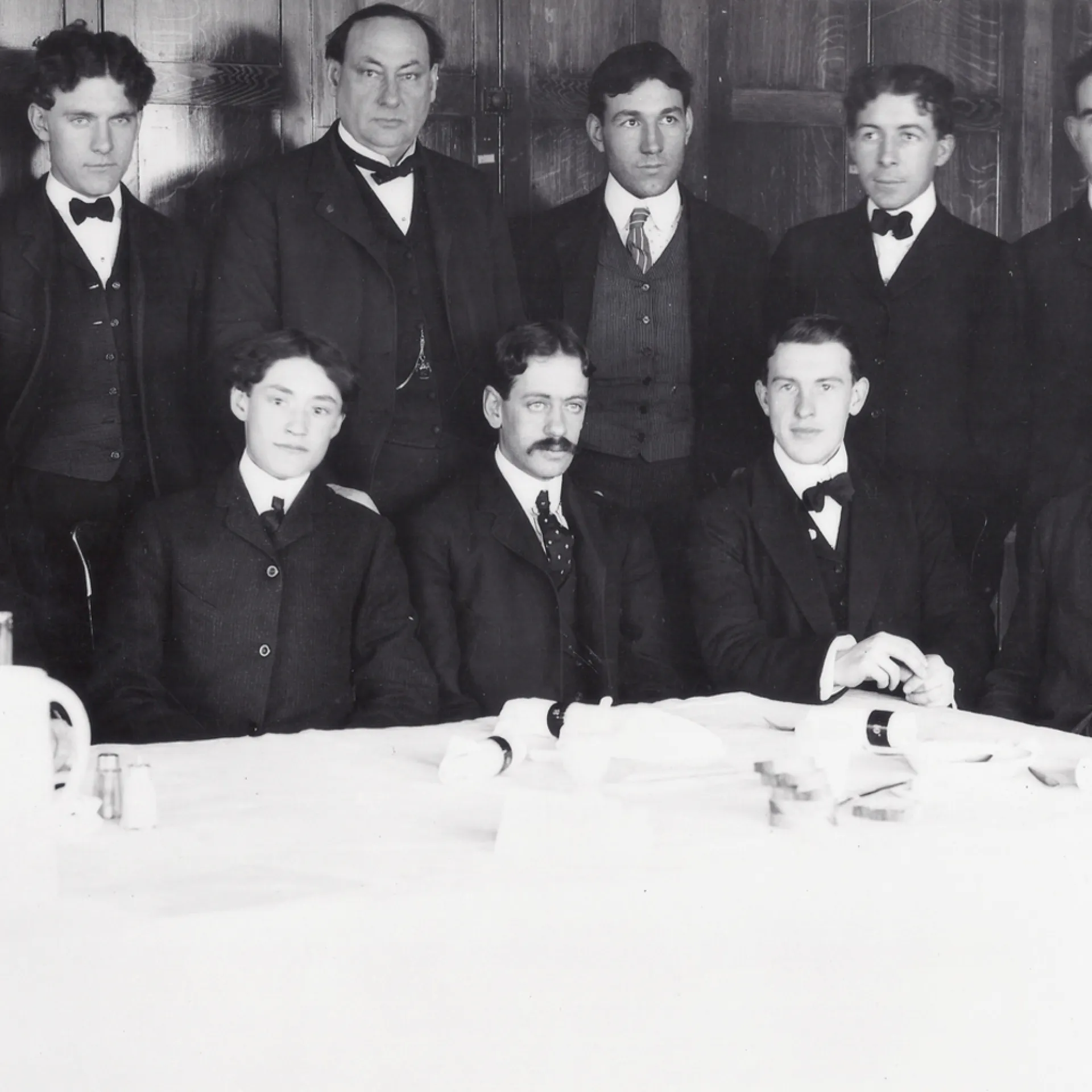 Young men of the government “Poison Squad” seated around a dining table, where they tested food preservatives on themselves